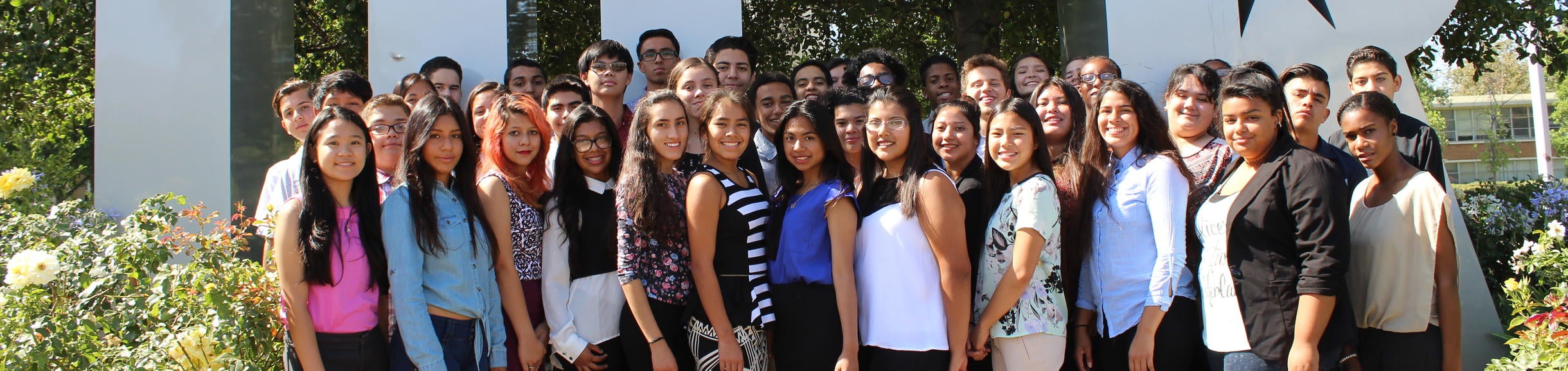 MLT Group Shot in front of letters